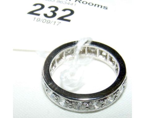 A diamond full eternity ring in white gold setting