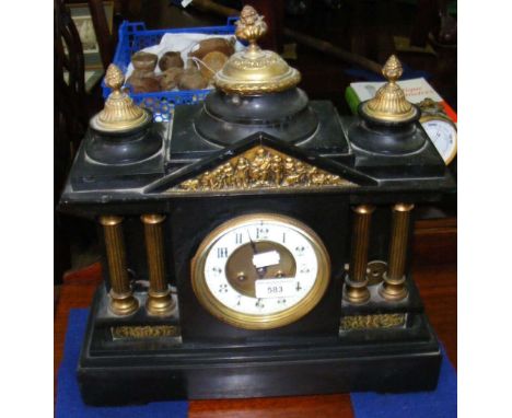 A Victorian slate mantel clock with striking movement - 40cm high