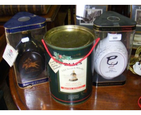 An unopened bottle of Bell's Scotch Whisky - Extra Special, together with two unopened souvenir decanters