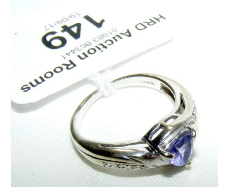 A 9ct white gold tanzanite and diamond ring