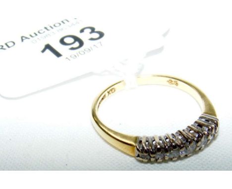 An 18ct yellow gold seven stone diamond half hoop eternity ring