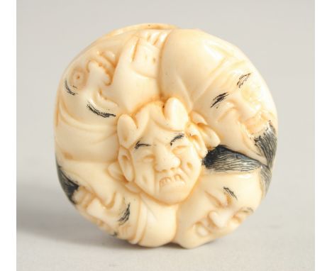 A CHINESE CARVED BONE NETSUKE. 1.5ins diameter.