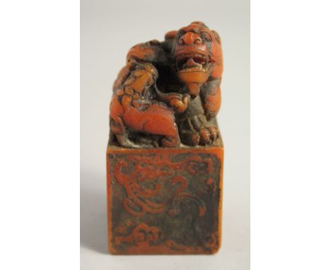 A CHINESE CARVED SOAPSTONE DRAGON SEAL. 4ins high.