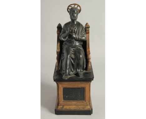 AFTER THE ANTIQUE. A 19TH CENTURY BRONZE SAINT SITTING ON A THRONE 14ins high.