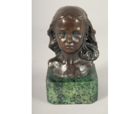 A SMALL BRONZE OF A GIRL. 4.5ins long on a marble base.