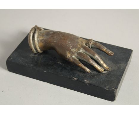 AN ITALIAN BRONZE HAND. 5ins long on a black marble base.