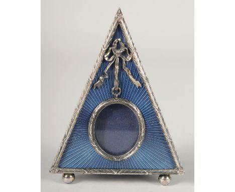 A KITNEY &amp;CO. RUSSIAN DESIGN SILVER AND ENAMEL TRIANGULAR PHOTOGRAPH FRAME. 5ins x 3.5ins in a Kitney box.