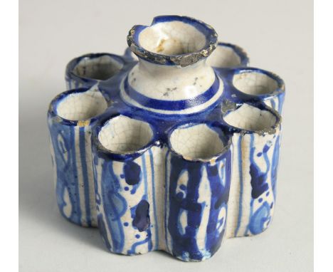 AN EARLY ISLAMIC POTTERY EIGHT DIVISION INKWELL. 3.5ins diameter.