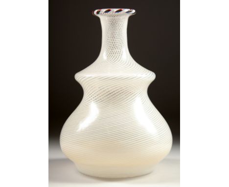 A BULBOUS GLASS DECANTER, possibly NAILSEA. 7ins high.