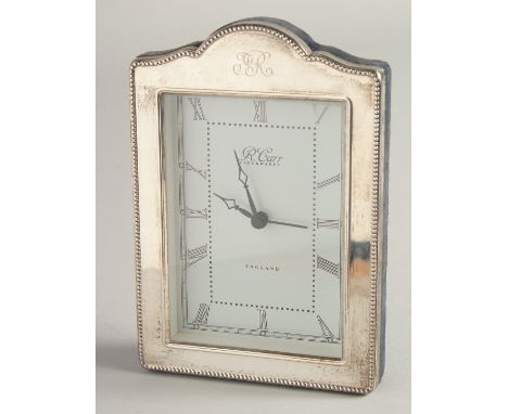 A SILVER UPRIGHT EASEL CLOCK by R. CARR, with bead edge. 6.5ins high x 4.5ins wide.