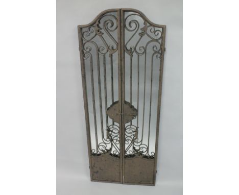 A MIRRORED BACK CAST IRON GATE. 5ft high.