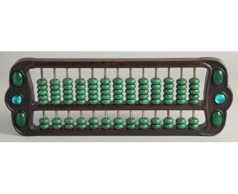 A CHINESE TURQUOISE BEADED HARDWOOD ABACUS.