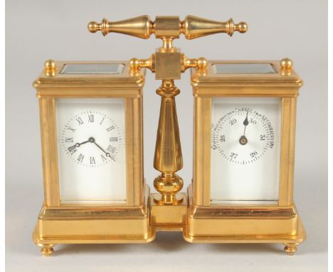 A GILT BRONZE DOUBLE CARRIAGE CLOCK. 4ins high with carrying handle.