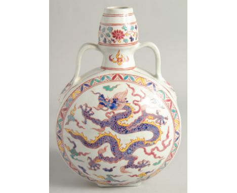 A CHINESE WUCAI PORCELAIN TWIN HANDLED MOON FLASK decorated with a central dragon. 29cm high.