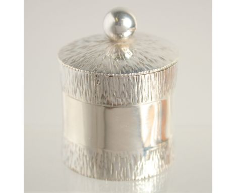 A SILVER CIRCULAR DRUM AND COVER London 1968, maker R. M.