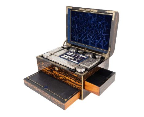 A Victorian travelling dressing table set,the mounts by William Neal, London 1874,engraved chased scroll foliate decoration w