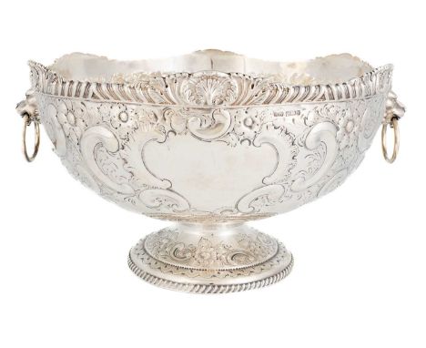 A late-Victorian silver punch bowl, by H. Atkins, Sheffield 1891, circular form, embossed foliate scroll decoration, lion mas