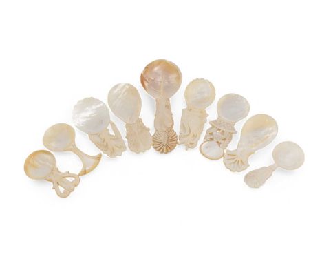 A collection of nine late-18th/early-19th century mother-of-pearl caddy spoons, various designs including one with a pierced 