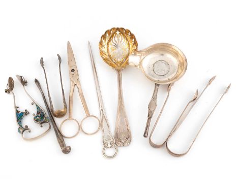 A mixed lot of flatware, comprising: a Tiffany silver sugar sifter, four pairs of sugar tongs, a toddy ladle bowl, a pair of 