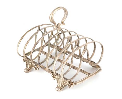 A George III silver toast rack, by William Eley & William Fearn, London 1804, rounded rectangular form, central carrying ring