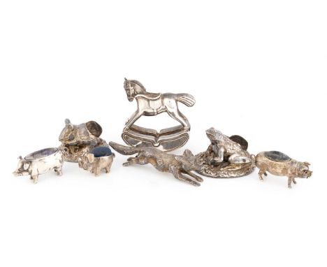 A collection of silver animals,comprising: a running fox, by William Hutton and Sons, Sheffield 1935, a pig pin cushion, Birm