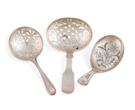 A collection of three George III/IV silver caddy spoons,  all with pierced bowls, comprising: one by Joseph Willmore, Birming