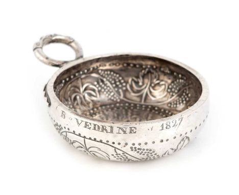 An early-19th century French silver wine taster,maker's mark of G.B, circa 1827,circular form, double snake ring handle, deco