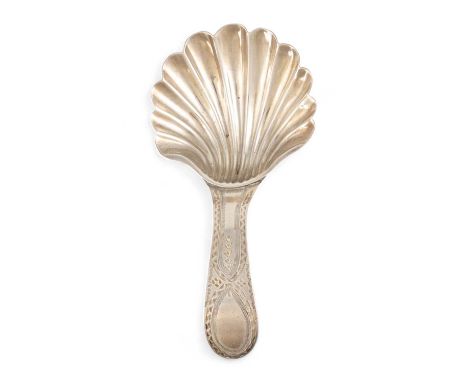 A George III silver Bright-cut caddy spoon, by Hester Bateman, London 1789, shell bowl, vacant terminal, length 8.5cm, approx