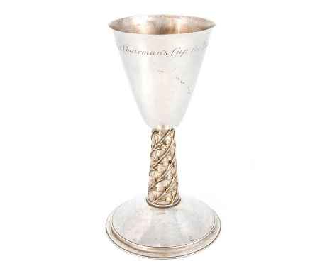 By the Guild of Handicrafts Limited, an Edwardian Arts &amp; Crafts silver and gold-mounted chalice/goblet,London 1905,taperi