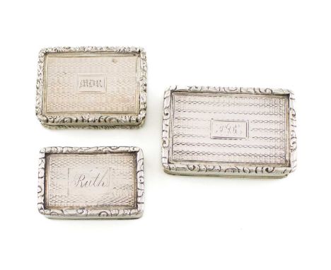 A collection of three antique silver vinaigrettes,rectangular form, engine-turned decoration with foliate borders, with pierc