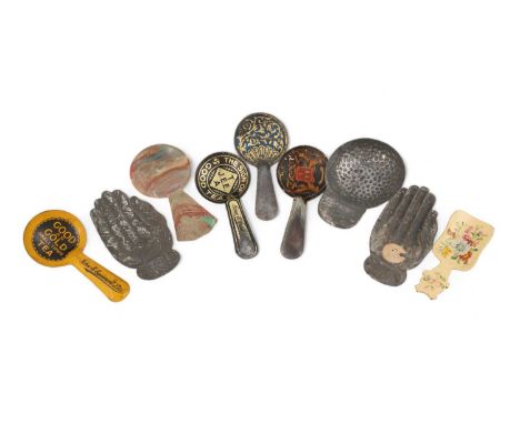 A small collection of seven caddy spoons, including tin-plate, plastic and painted examples, some with advertising logos and 
