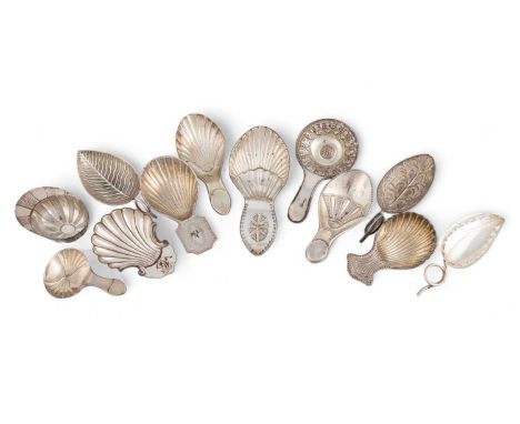A collection of old Sheffield plated caddy spoons, various designs and makers, including a jockey cap, three of leaf form, an