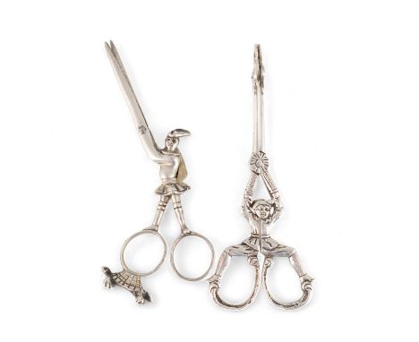 A pair of late-Victorian novelty silver tongs, by S. Jacobs, London 1893, modelled as a man with spread legs, mask bowls, plu