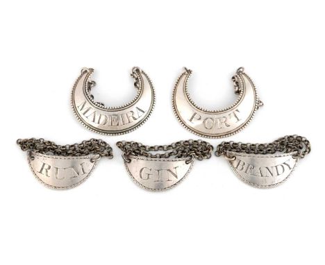 A pair of George III silver wine labels, by Susannah Barker, London circa 1790, crescent form with a beaded border, incised '