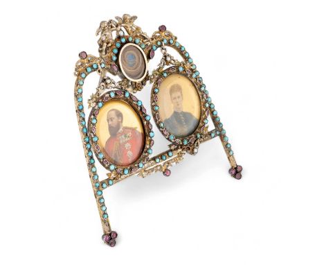 An Austro-Hungarian silver-gilt double frame, with enamelled decoration and set with turquoise borders and red stones, mounte