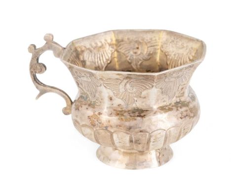 A mid-18th century Russian silver vodka cup,maker's mark 'E.A' over 'K' in a heart, Moscow 1777,octagonal bellied form, part-