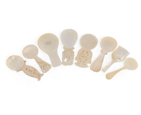A collection of eight mother-of-pearl caddy spoons, the majority 19th century, various designs, some with pierced and engrave