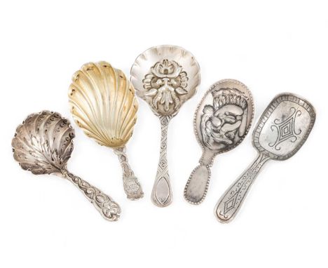 A small collection of five silver caddy spoons,  various dates and makers, including one later embossed with Mr Punch, anothe