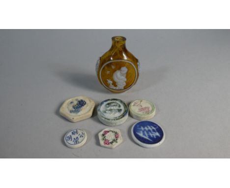 A Collection of Chinese Ceramic Counters and a Glass Snuff Bottle with Monkey Decoration 