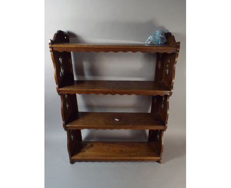 An Edwardian Oak Wall Hanging Four Shelf Unit with Pierced Supports, 30cm Diameter 