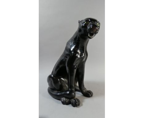 A Large Ceramic Study of a Seated Puma 