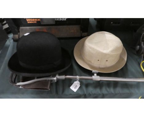 A Shooting Stick, Bowler Hat and Two Other Hats 