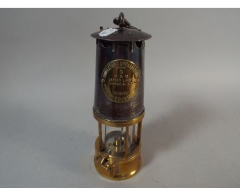 A Vintage Miners Safety Lamp with Brass Mounts by the Protector Lamp and Lighting Company 