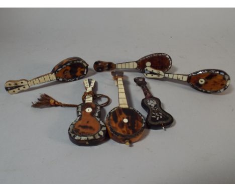 A Collection of Six Mother of Pearl and Tortoiseshell Miniature Instruments to Include Guitar, Banjo and Mandolins 