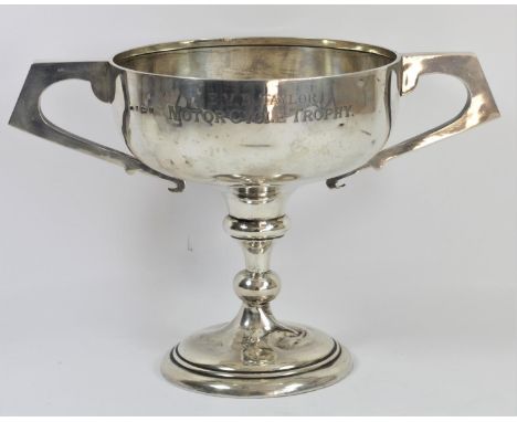 A silver two handled trophy, Birmingham 1923, inscribed 'E.V.B. Taylor, Motorcycle Trophy', raised on a knopped pedestal, pli