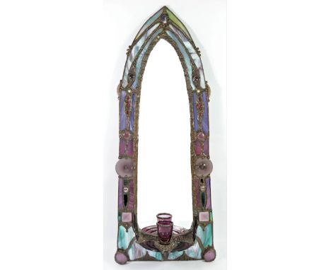 John Leathwood, Hull, an arched wall mirror with night light candle holder, with multi coloured stained glass border, 75 x 29