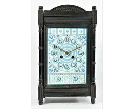 An Aesthetic Movement mantle clock, c.1880/90, the pottery tile dial mounted in an ebonised case, the movement signed B.R., n