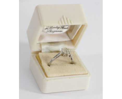 An Edwardian single stone diamond ring, tests as platinum, by S &amp; Co., claw set with an old cut brilliant stone, calculat
