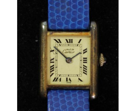 Cartier Le Must, a silver gilt manual wind ladies Tank wristwatch, case number 3231242, sapphire winder, blue lizard skin Hir