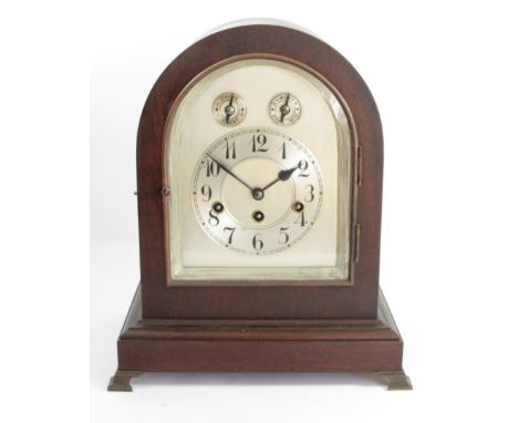 An Edwardian mahogany chiming and striking mantle clock, the silvered dial with subsidiary chime/silent and fast/slow dials, 